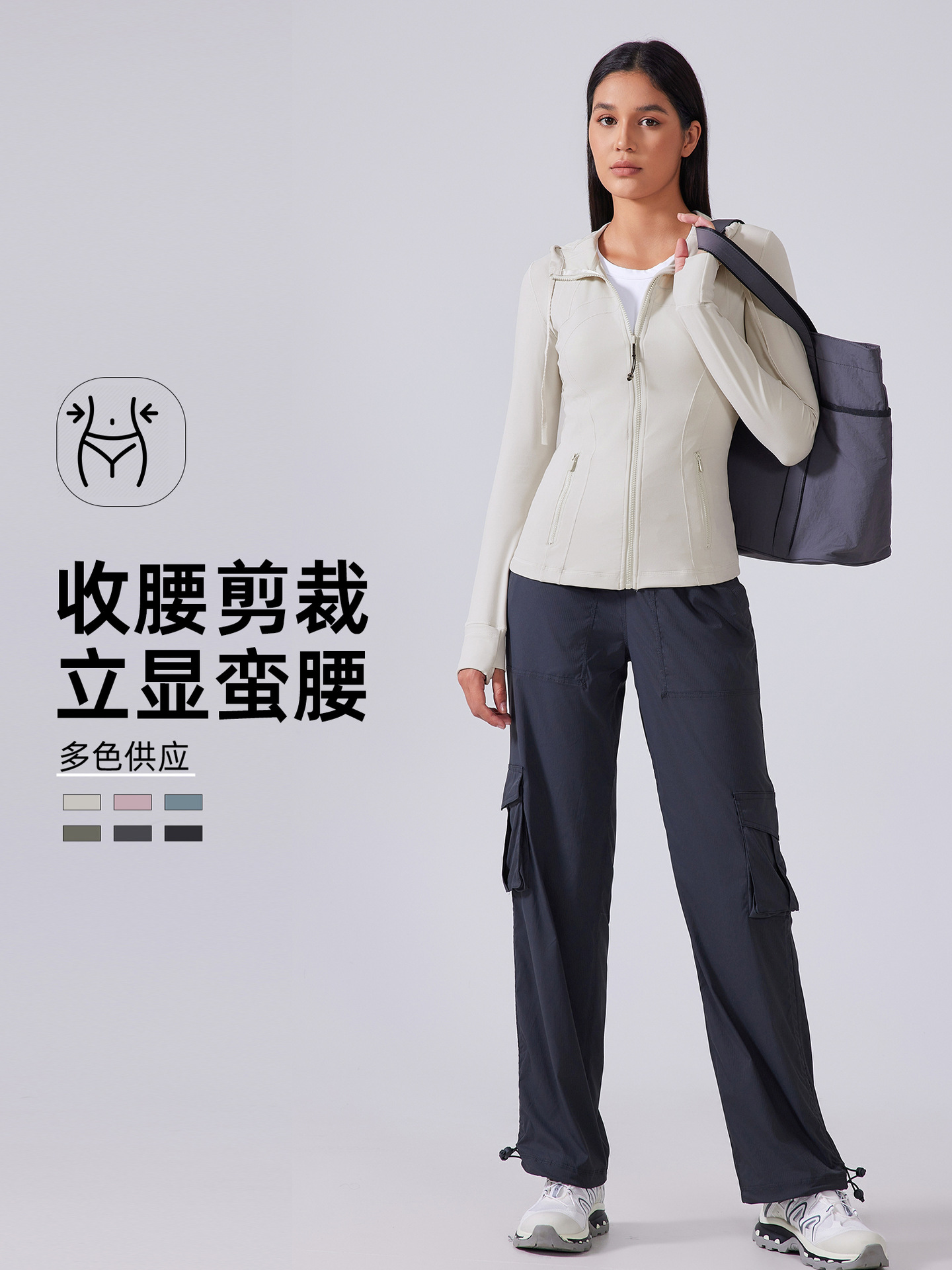 秋の新型ヨガ服の女性は帽子のファスナーの運動のコートを持っています。