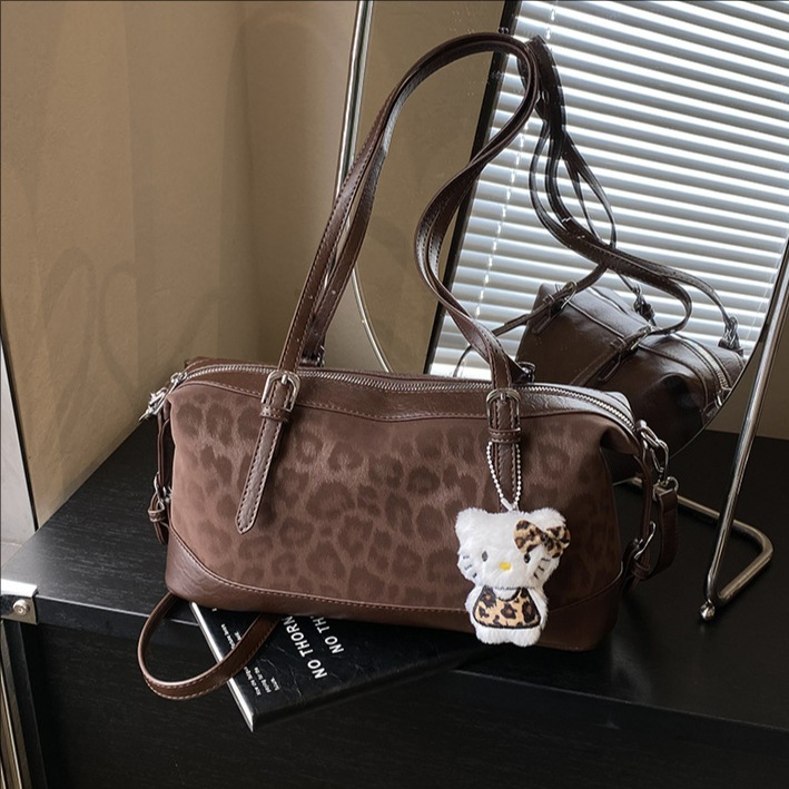 Bolsa de almohada retrógrada de leopardo bolso de mano de viaje para mujeres otoño y invierno 2025 nueva moda simple bolso de hombro axilar