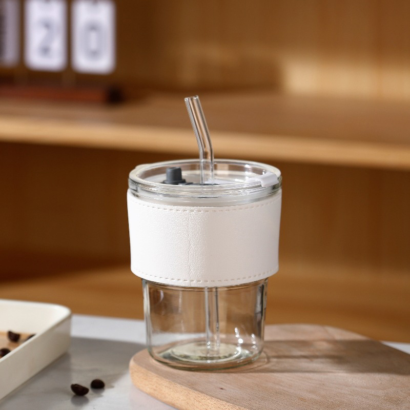 Tazas de vidrio de bambú en línea resistentes al calor tazas de paja de café ins viento alto valor de mano impresión de tazas de agua de regalo