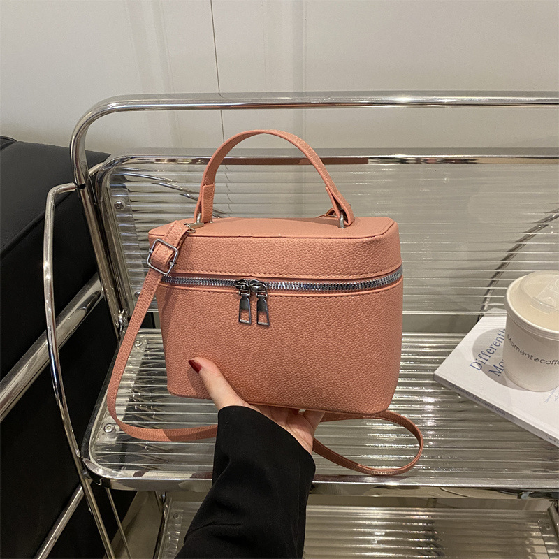 Bolsos para mujer nuevo estilo 2025 primavera nicho todo-fósforo bolso de mensajero de moda de hombro patrón de lichi bolso de cubo de lujo ligero