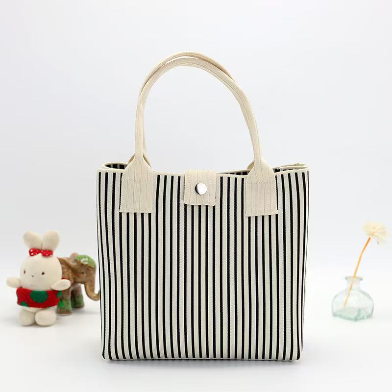 Japón y Corea del Sur tejido bolsas de mano bolsas de viaje de gran capacidad bolsas de compras de chicas fabricantes de bolsas H al por mayor