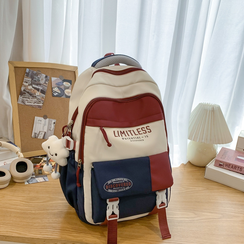 Mochilas escolares de alto valor facial nuevas estudiantes de primavera 2025 moda ligera y viajes al aire libre de gran capacidad con bolsos de hombro