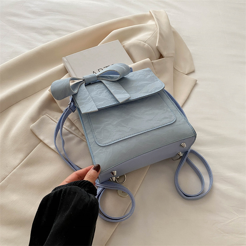 Mochila de hombro de arco para mujeres 2024 nueva moda estilo académico mochila de estilo universal bolso de mano bolso de viaje