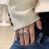 Glossy retro ring, silver 925 sample, on index finger