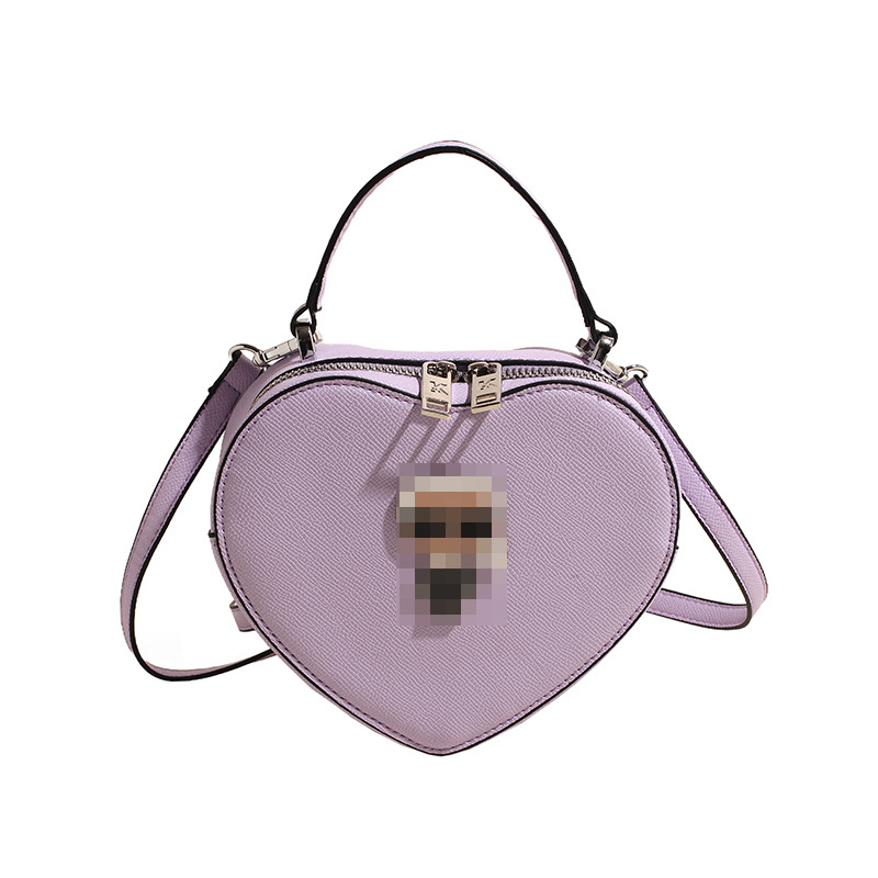 Bolsos transfronterizos para mujer 2024 nuevo bolso de hombro con diseño de corazón de nicho de moda bolso de mensajero portátil de amor de alta gama