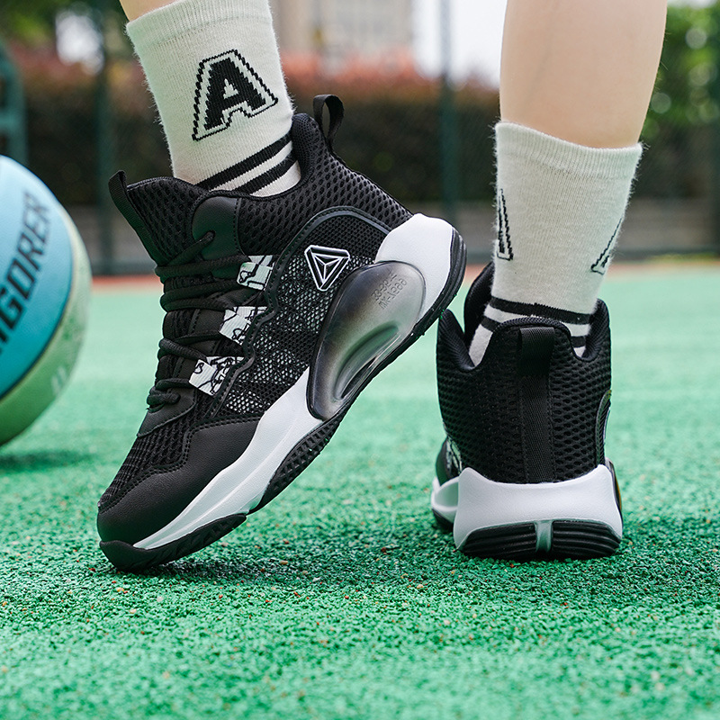Zapatos de baloncesto para niños primavera y otoño 2025 zapatos de baloncesto transpirables de malla para estudiantes de primaria entrenamiento de combate real zapatos de baloncesto de alta altura