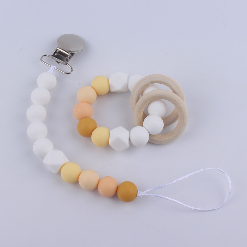 Nuevos suministros para bebés Cadena de chupete DIY creativo contraste color cuentas de silicona mordedor anti-caída traje de cadena