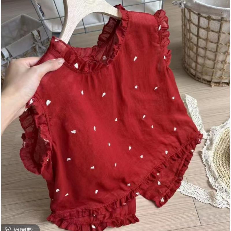 Korean-style heart-printed ruffled shirt for women, 2026 summer collection, with ruffled hem and back-button closure