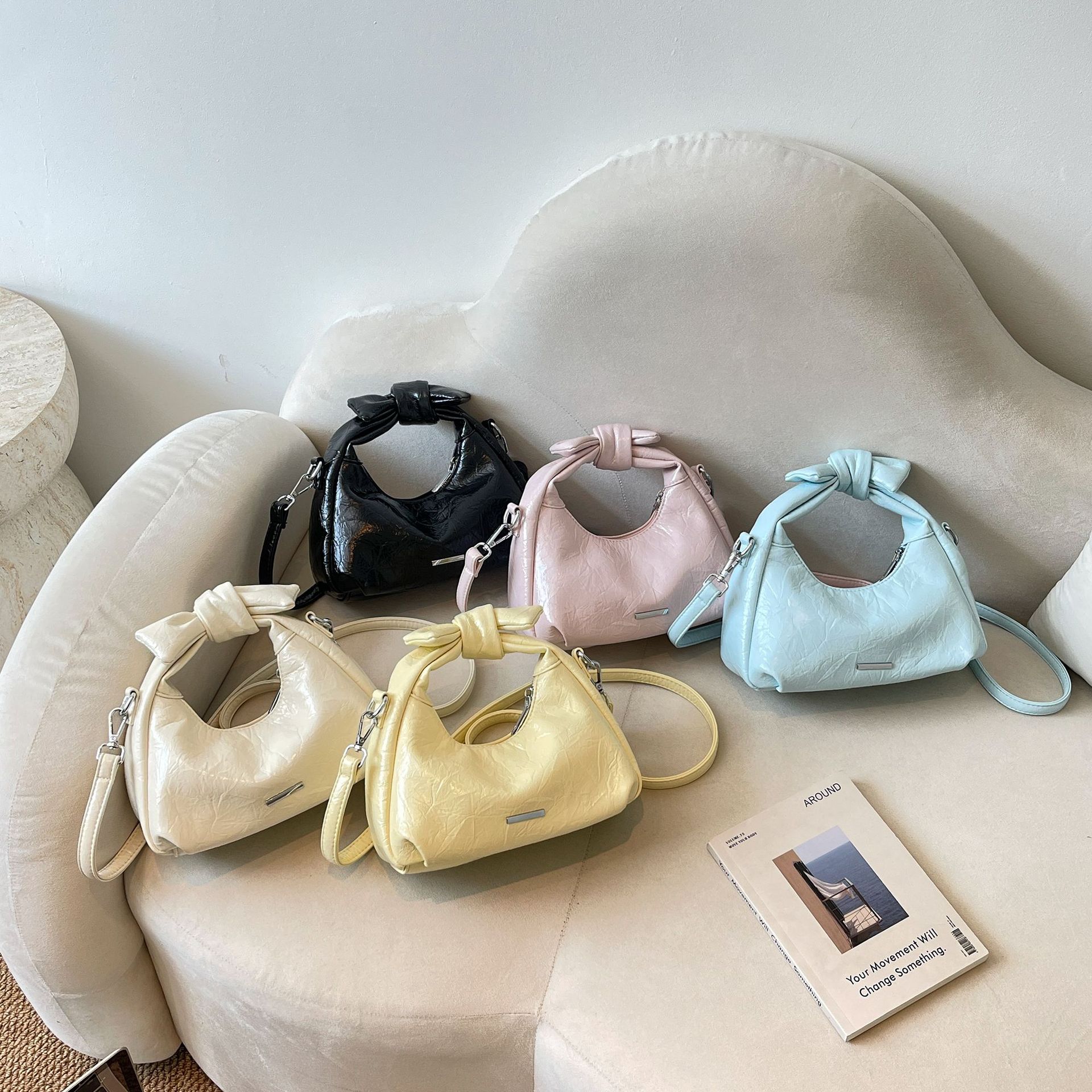 Bolsa de mano de arco para mujeres 2026 nuevo bolso de hombro de moda de verano super caliente sensación diaria mochila de viaje