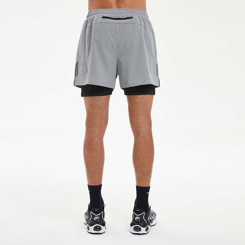 Pantalones cortos de secado rápido de doble capa para hombres de verano fitness pantalones de entrenamiento multibolsillos transpirables de alta elasticidad en stock al por mayor