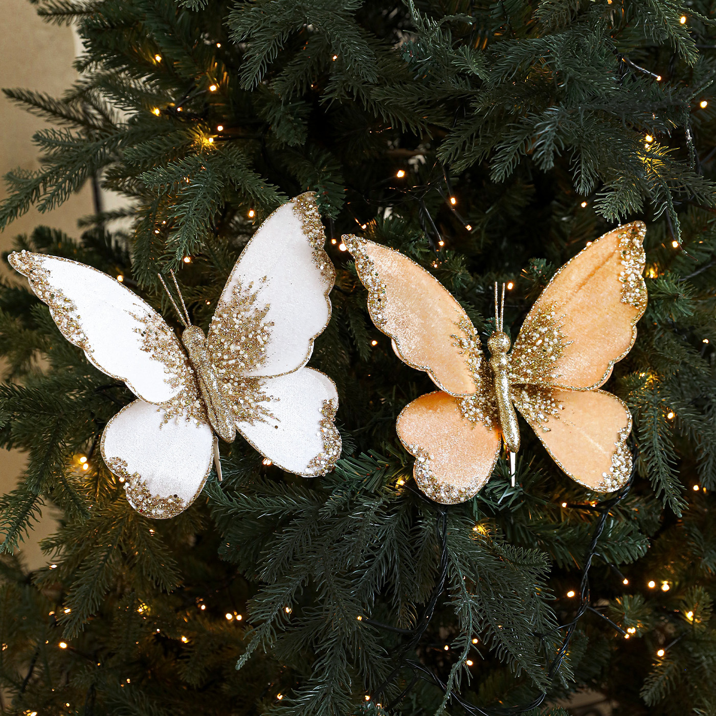 Nuevos productos de tela de alta calidad simulación de clip de arco de mariposa tela de vello polvo flocado árbol de Navidad decoración colgante diseño de escena