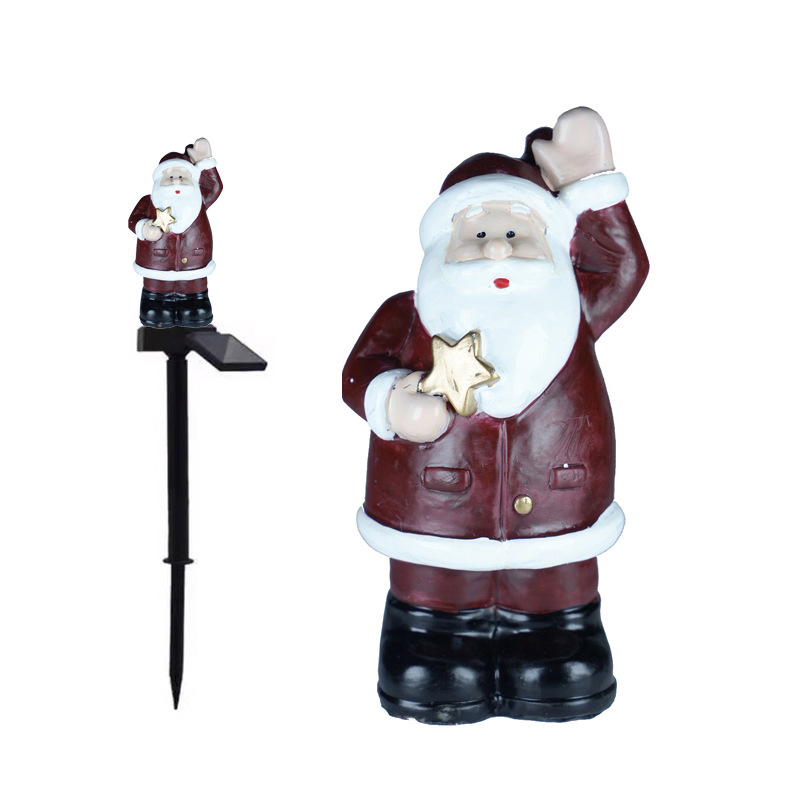 Luces de suelo con forma de estrella y Papá Noel con energía solar