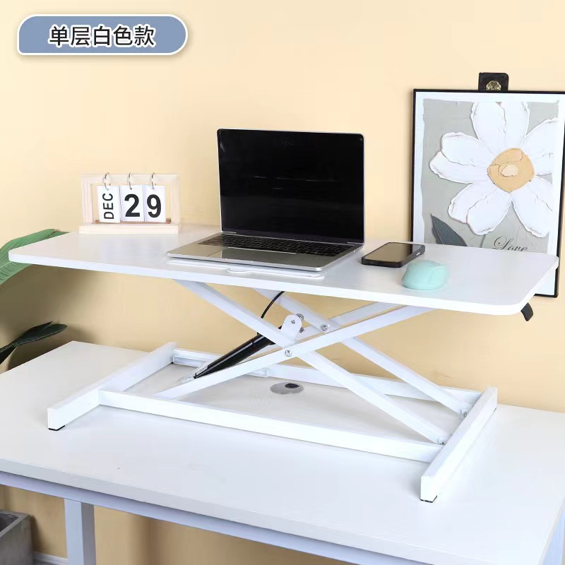 気動机の上のコンピュータの机は立式の事務室の台の上に立って高くなるノートの折り畳みの机で机を昇降することができます。