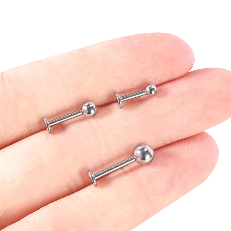 Silver pointed spike labret stud material detail