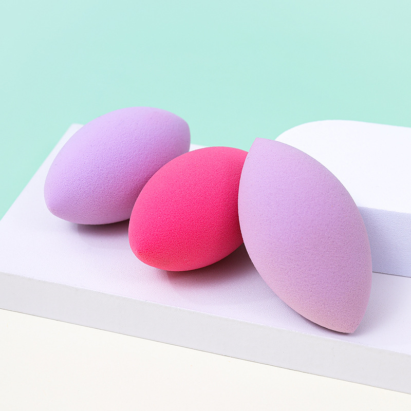 Fábrica personalizada ovalada belleza huevo soplo de polvo no come polvo no látex transfronterizo rugby maquillaje esponja huevo cojín de aire
