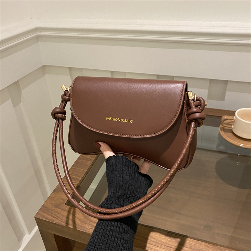 Hong Kong retro color sólido bolso de mujer de estilo extranjero 2025, primavera coreana de textura bolso de hombro de moda bolso de moda
