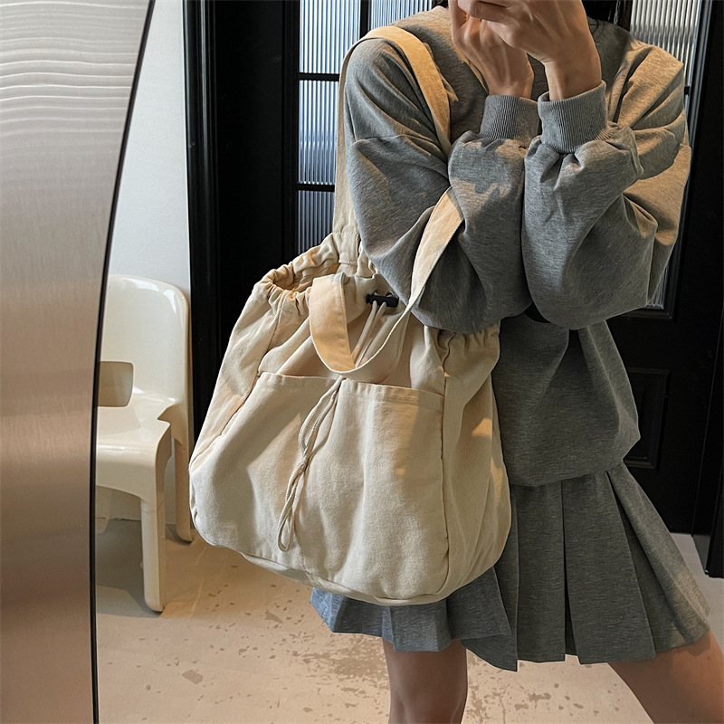 2025 New Canvas Bag Women's Single Shoulder Large Bag Drawstring Multi-Pocket Japanese Style Large Capacity Casual Storage Travel Bag 2025 New Canvas Bag Women's Single Shoulder Large Bag Drawstring Multi-Pocket Japanese Style Large Capacity Casual Storage Travel Bag