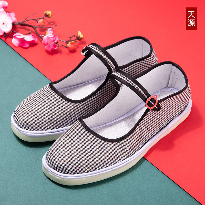 Zapatos casuales viejos de Beijing zapatos cosidos con suela de tendón de res tela de algodón boca baja suela plana suela de tendón de res zapatos de madre para mujer suela suave primavera y otoño
