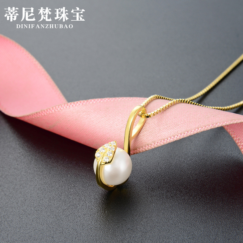 Corea del Sur Dongdaemun Luz de lujo clavícula cadena collar S925 plata diamante-incrustado oro amarillo grano hoja colgante hembra al por mayor