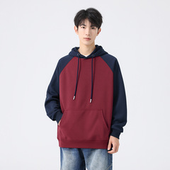 カジュアルフード付きの男性の秋の新作韓国版の肩の袖を挿して色を合わせます。