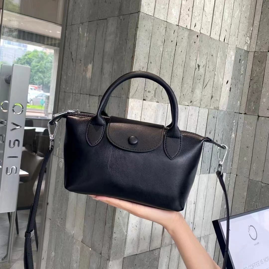 Bolsos femeninos 2024 nuevos bolsos femeninos de cuero de alta costura de moda 100 bolsos correccionales para viajeros de nicho bolsos portátiles