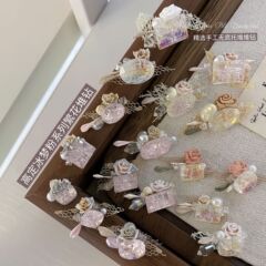 桜の花粉欧根紗の完成品のドリルのネイルのダイヤモンドは氷の花粉の桃の花の花のシリーズの手作りの爪の装飾品を飾ります。