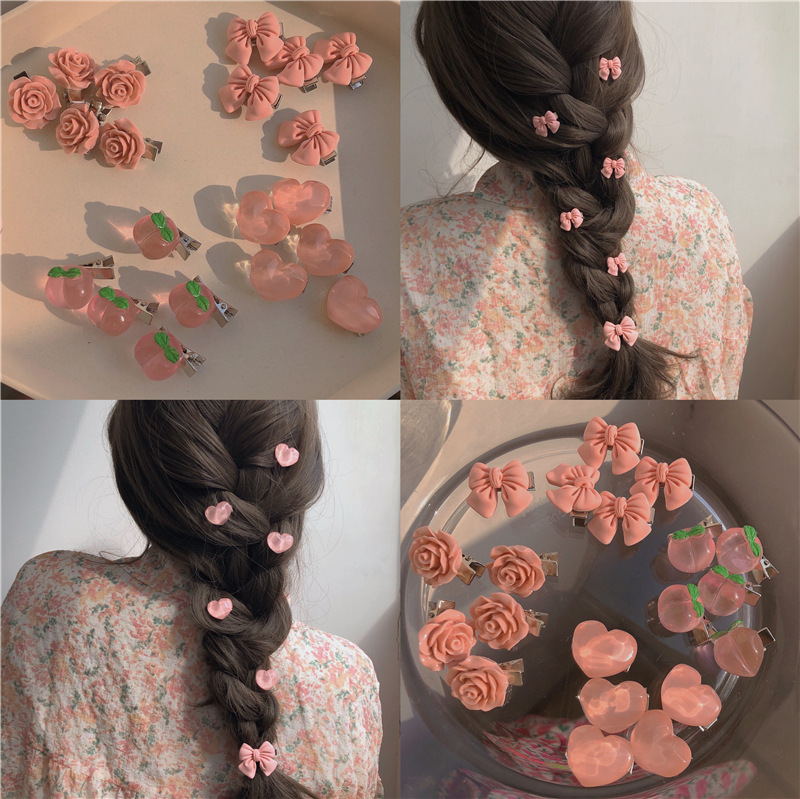 Super-cute pink hair clip collection! Girls' bow, peach blossom, camellia, and heart-shaped side clips—stylish hair accessories and headwear