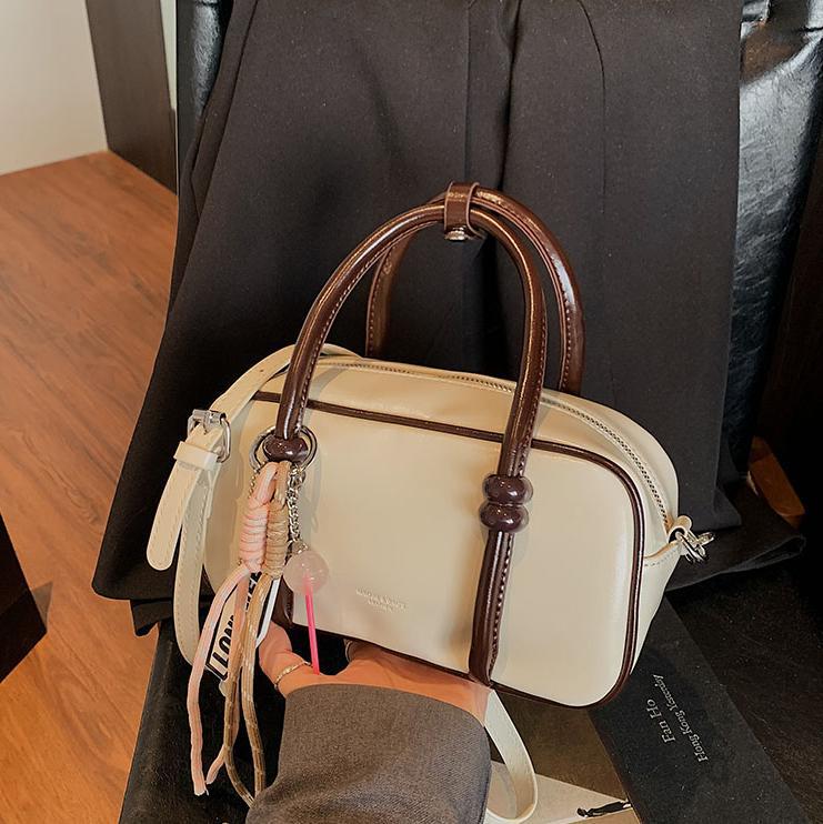 Colores contrastantes de tendencia universal bolso de bolos de mano mujer 2025 nuevo estilo de alto nivel de moda casual mochila de hombro