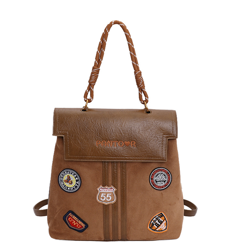 Comercio exterior insignia transfronteriza clase universidad mochila de viaje de la escuela de moda mejora la sensación de calidad retro mochila de gran capacidad
