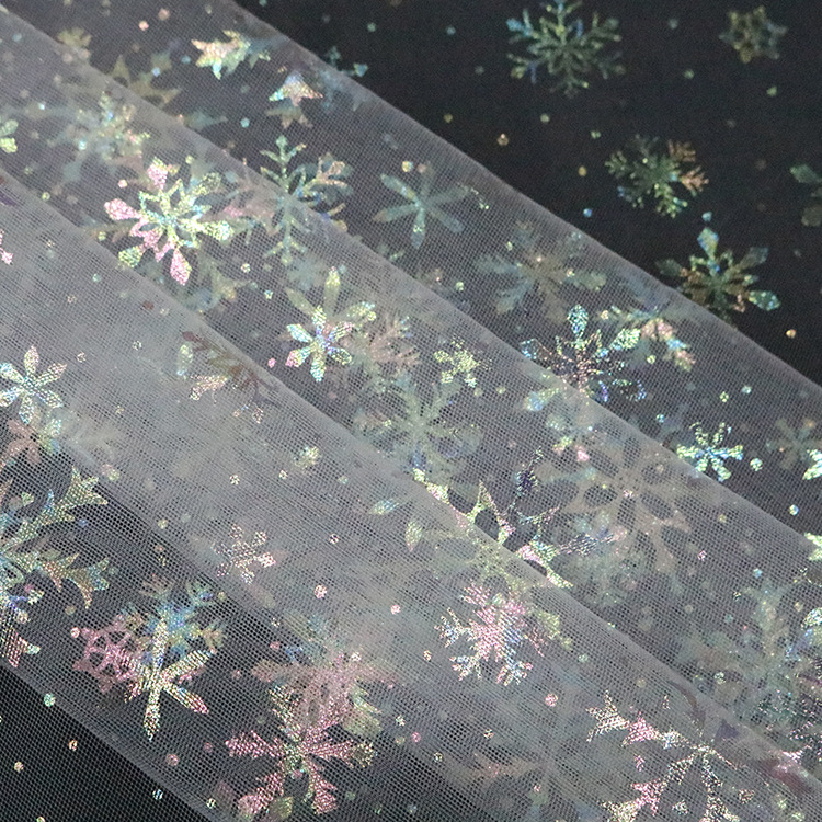 Fabricante de suministro de malla suave criptografada tela de ropa infantil flocos de nieve ropa de mujer tela de embalaje de flores DIY
