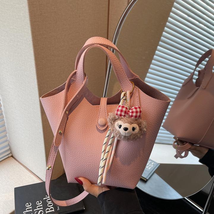 Bolso de canasta de verduras transfronterizo para mujer 2025 nuevo bolso de hombro casual simple bolso de cubo de mensajero de cuero suave de todo fósforo