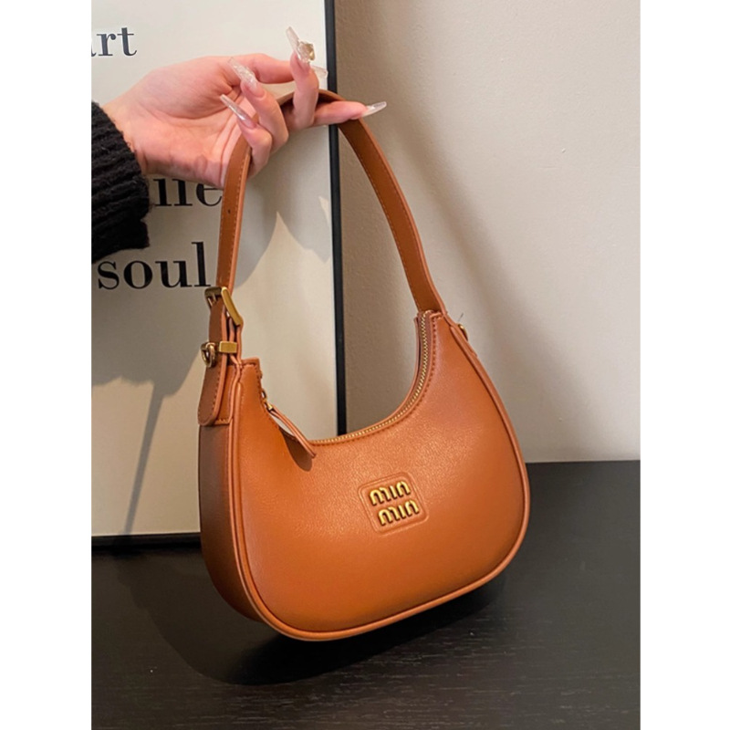 Bolso pequeño para mujer 2025 nueva bolsa de media luna bolsa de bola de masa de otoño e invierno bolso de mensajero negro de viaje bolso de la axila de mano