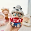 Grizzly ear hat + a row of red love hearts + black framed glasses + blue jeans