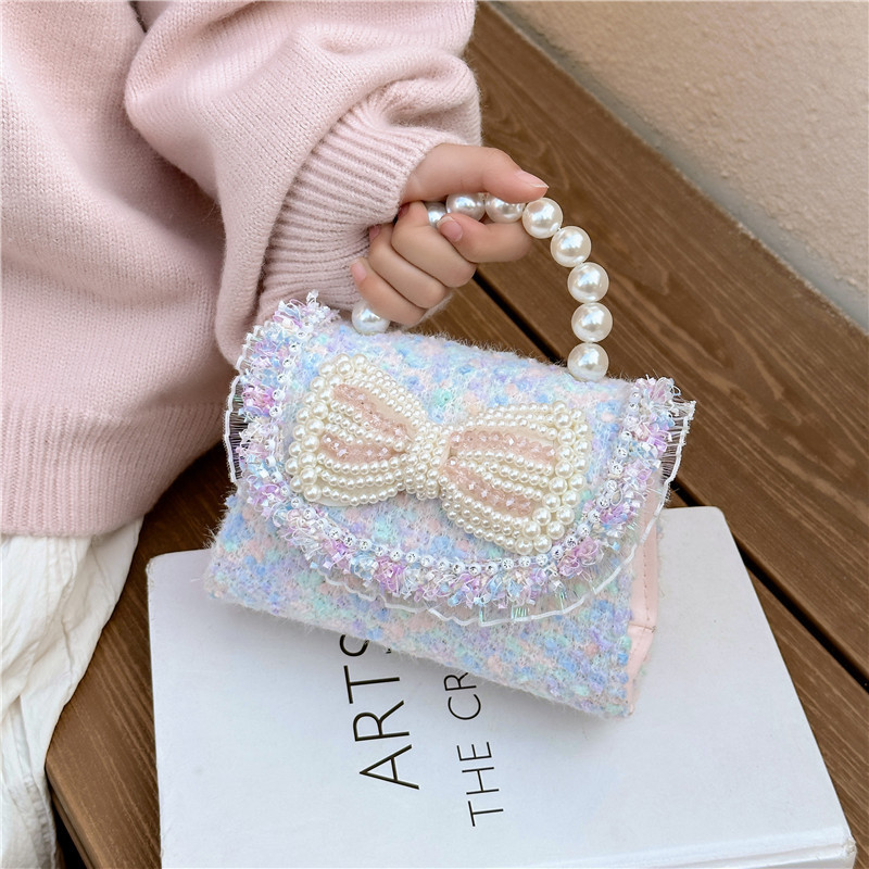 2025 otoño y invierno nuevo arco de perlas de arco de perlas bolsas de niños de tween lindas caricaturas princesa mochila