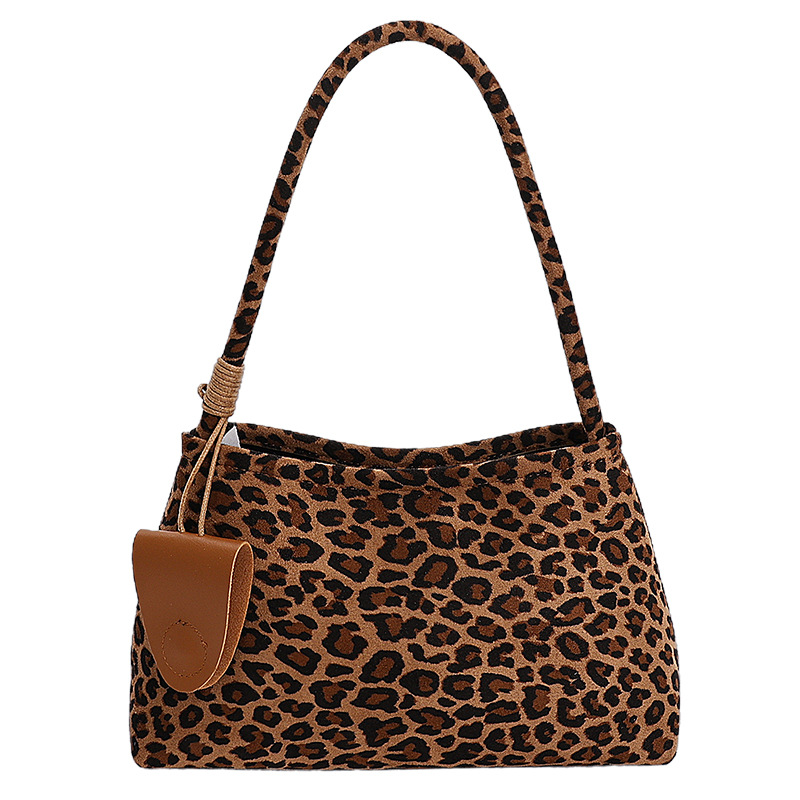 Niche de alta sensación de seda de abrigo bolso inferior para mujeres otoño / invierno 2025 nueva moda de moda universal bolso de mano de viaje