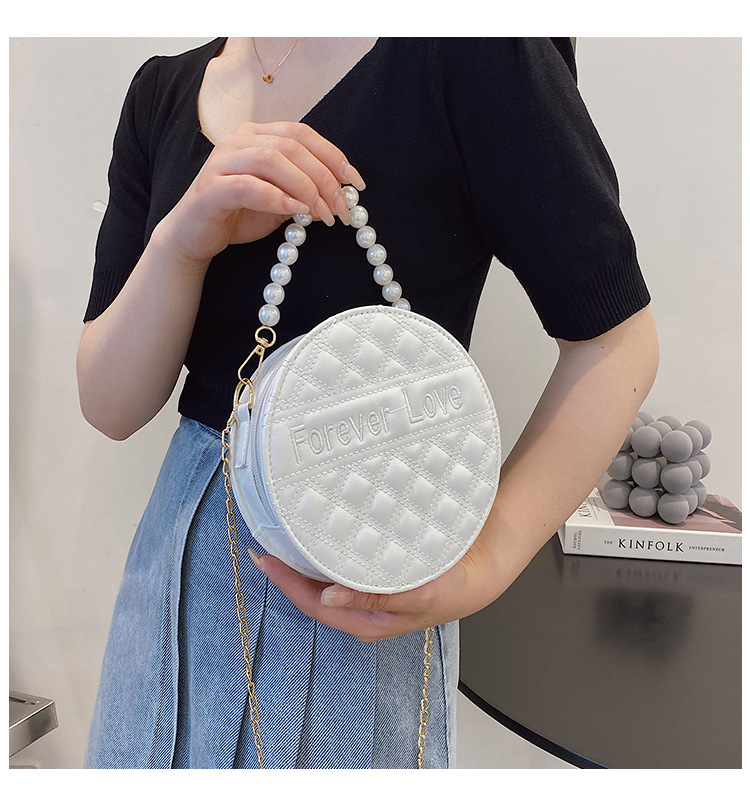 Fashion Solid Color Embossed Pearl Handle Small Round Bag display picture 11