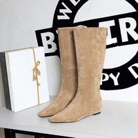 6632-35 Korean version high top women's boots are simple, fashionable, and versatile. They have a mid heel, sloping heel, and an inner height increase. The suede high top boots are made of suede