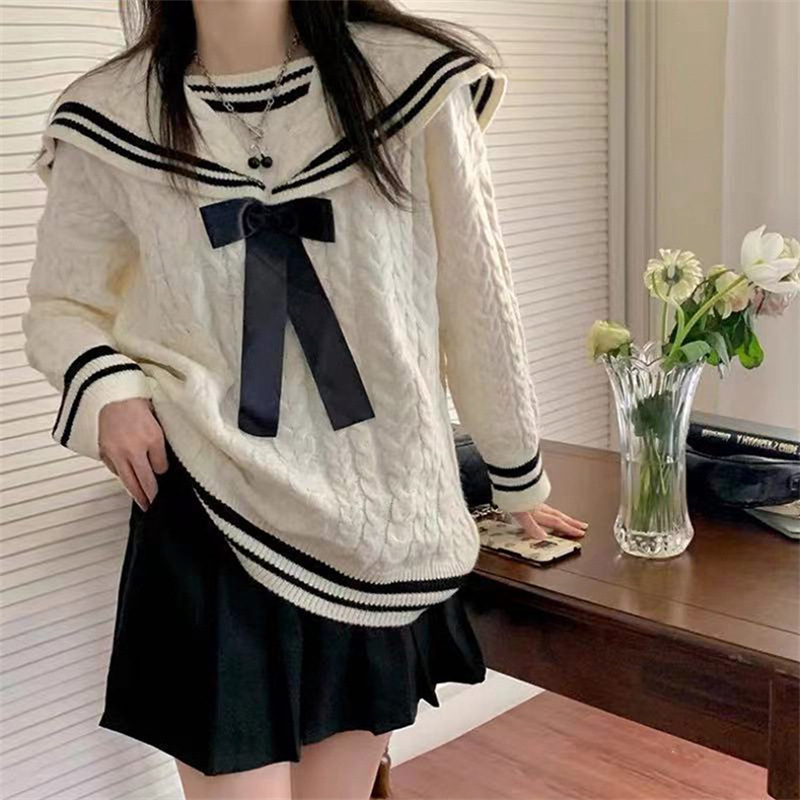 Navy knitted demi-season sweater with bow