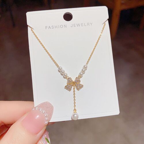 Sweet niche light luxury jewelry women's new bow pearl necklace pendant clavicle chain sweater chain