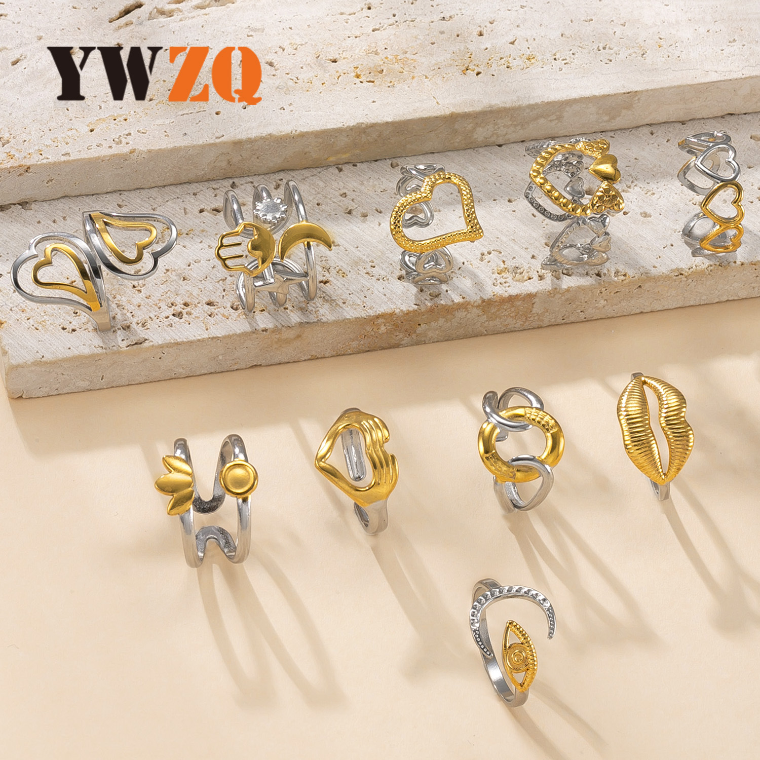 Venta caliente transfronteriza anillo de acero inoxidable diseño de nicho femenino anillo abierto a juego de colores aceite hueco amor fábrica de anillos de acero de titanio