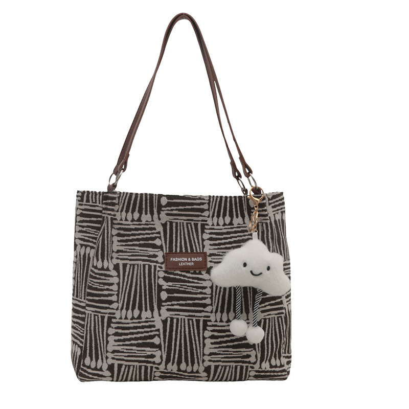 Bolso a rayas casual de todos los partidos de nicho para mujer 2024 nuevo bolso de hombro de gran capacidad de moda retro bolso de viaje