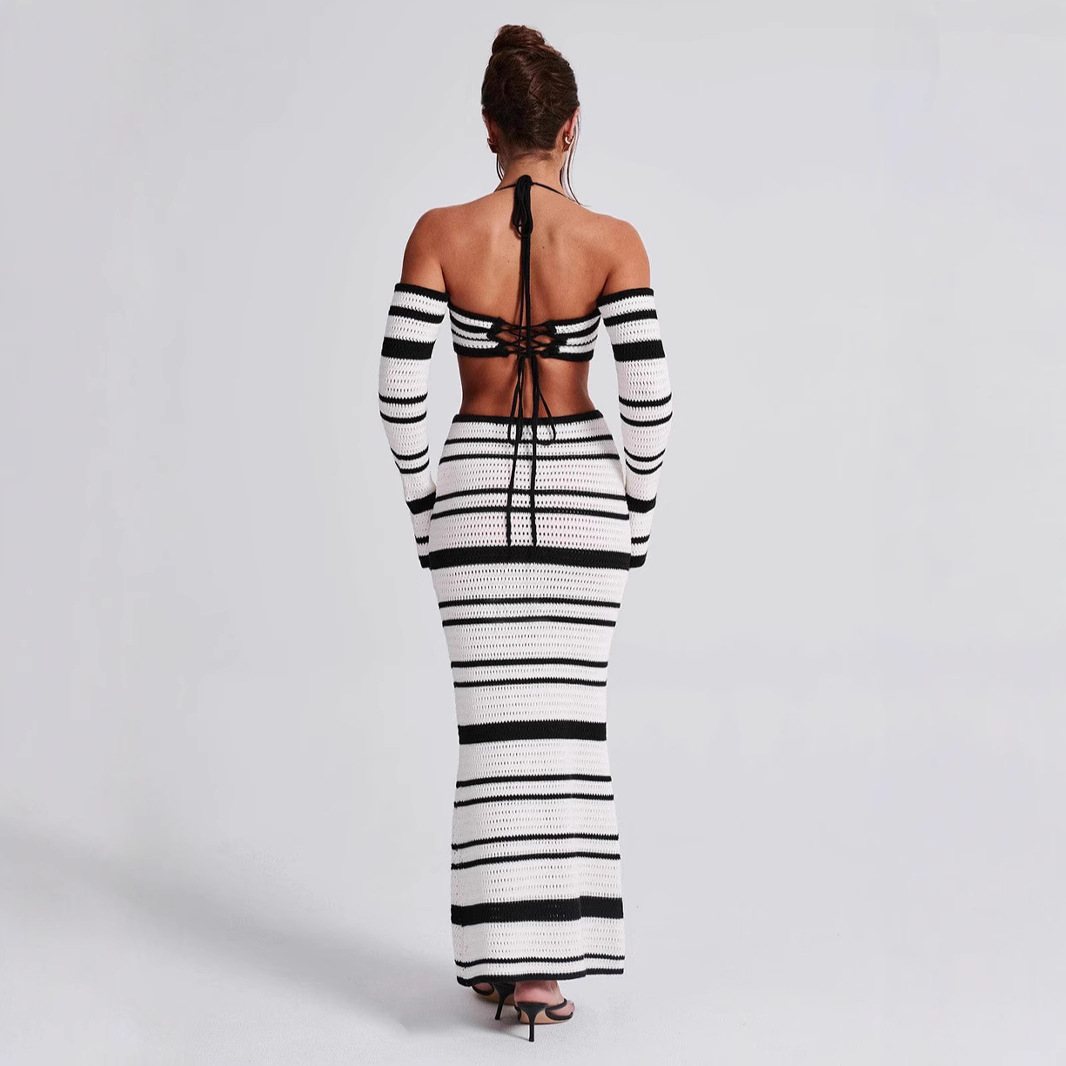 Conjunto de verano para mujer, estilo europeo-americano, con top halter de manga larga a rayas y falda, ideal para cruzar fronteras (2026)._voghion.com