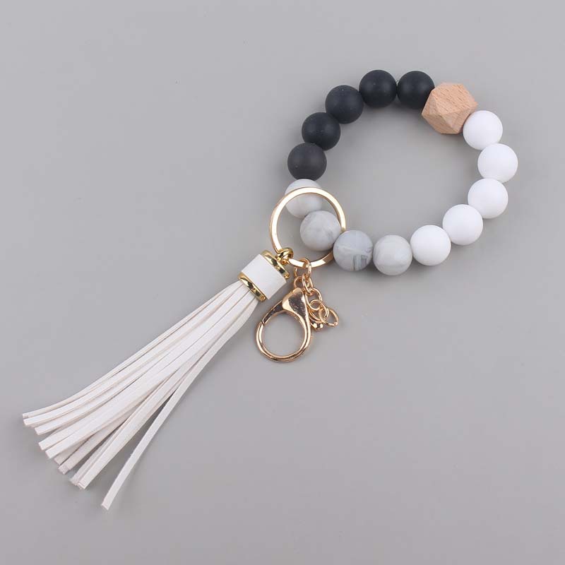 Nuevo cuero creativo pu borla colgante silicona muñeca llavero colgante silicona cuentas pulsera llavero