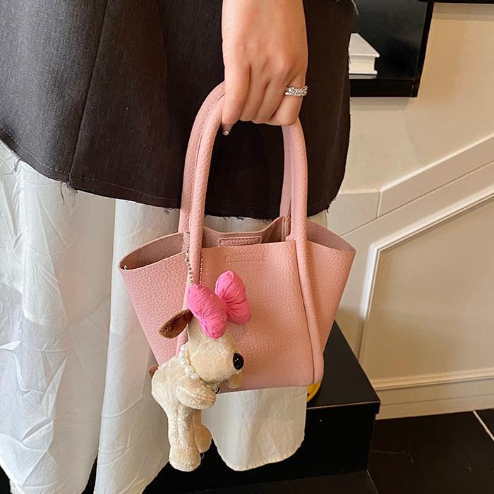 Bolso de cubo de mano de estilo explosivo transfronterizo para mujer 2025 nuevo bolso de hombro de alta gama de nicho bolso de cesta de verduras de moda coreana