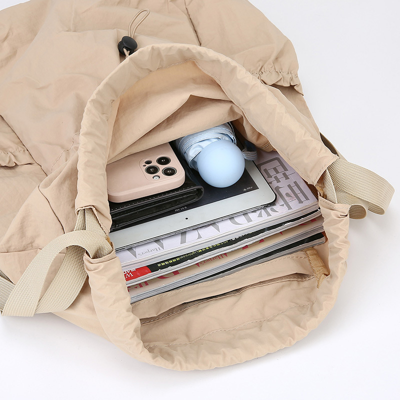 Mochila de cuerda ligera comercio exterior mochila al aire libre coreana de gran capacidad de mujeres viajes viajeros ociosos bolsa al por mayor