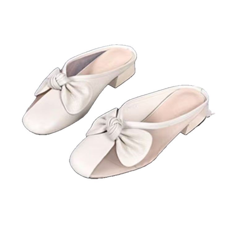 Zapatillas de piel suave de tacón bajo para mujeres primavera y verano 2026 nuevas zapatillas de tela plana para la cabeza de la bolsa para usar zapatillas de mujer