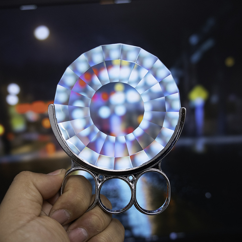 Hand-held crystal glass kaleidoscope prism photography foreground blurring effect creative filter