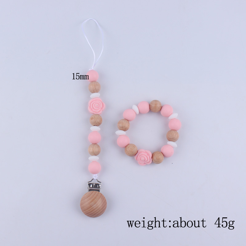 Nuevo bebé de dibujos animados de silicona de doble cara Rosa mordedor calmante bebé anti-gota cadena pulsera traje de juguete