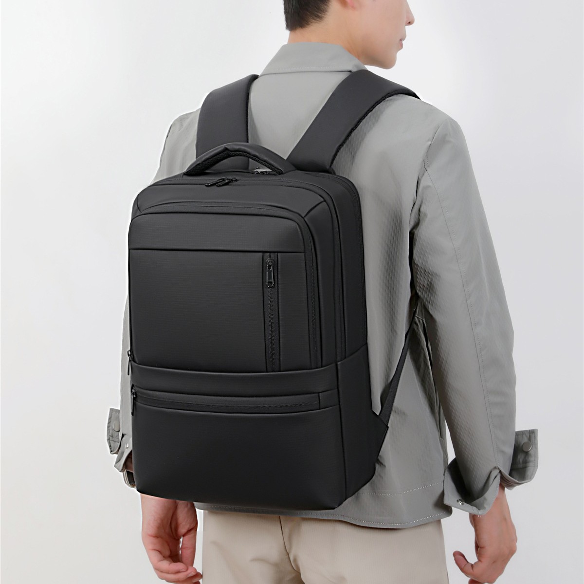 Cross-border large-capacity backpack, multifunctional, simple, stylish, suitable for business travel, students, and commuting, with a waterproof coating and designed to hold a laptop