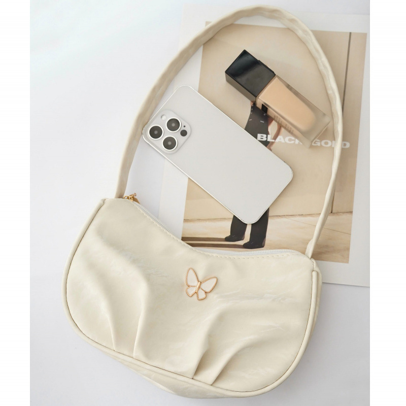 Bolsa de mariposa para mujeres 2025 verano nuevo estilo diario simple con casualidad de color sólido de hombro plegado en la parte inferior de la camisa